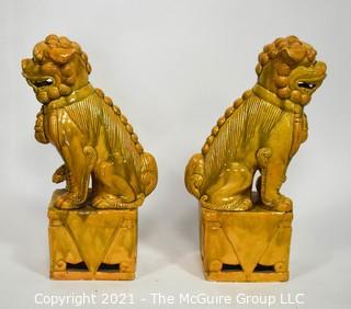 Pair of Heavy O.A.I. Oriental Arts Hong Kong Yellow Glazed Ironstone Foo Dogs; Some wear; Approximately 18.5" tall. 