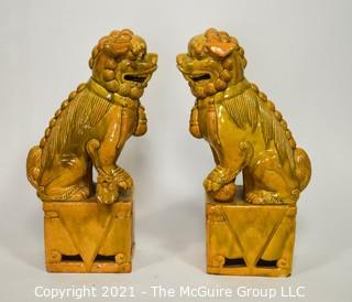 Pair of Heavy O.A.I. Oriental Arts Hong Kong Yellow Glazed Ironstone Foo Dogs; Some wear; Approximately 18.5" tall. 