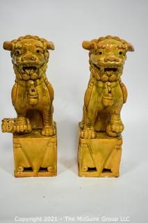 Pair of Heavy O.A.I. Oriental Arts Hong Kong Yellow Glazed Ironstone Foo Dogs; Some wear; Approximately 18.5" tall. 