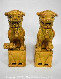 Pair of Heavy O.A.I. Oriental Arts Hong Kong Yellow Glazed Ironstone Foo Dogs; Some wear; Approximately 18.5" tall. 