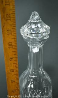 Waterford Crystal decanter with stopper; 12" tall.  (Note: damage to base of stopper)