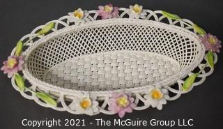 Belleek Lily Blossoms Basket, Annual Basket 2007, Numbered. Measures approximately 10" long.