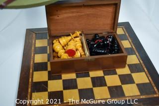 Collection including chess board with wooden pieces, Pentagon Renovation Program Hard Hat and Singaporean Field Hard Hat.  