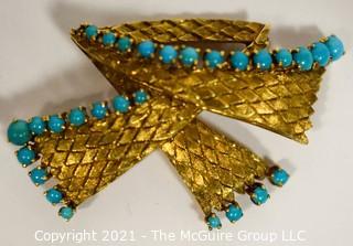 Vintage 18kt Gold Textured Brooch or Pin with Blue Gemstones.   Measures approximately 2" long and 17.6g in weight. 