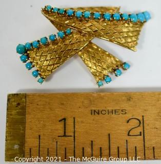 Vintage 18kt Gold Textured Brooch or Pin with Blue Gemstones.   Measures approximately 2" long and 17.6g in weight. 