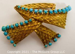 Vintage 18kt Gold Textured Brooch or Pin with Blue Gemstones.   Measures approximately 2" long and 17.6g in weight. 