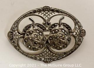 Sterling Silver Filigree with Marcasite Brooch.   Measures approximately 1 1/2' long.