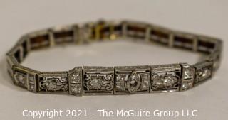 Antique Diamond Platinum over 14K Gold Art Deco Bracelet with Safety Catch.  Center Stone Missing.  Weighs approximately 15.8g