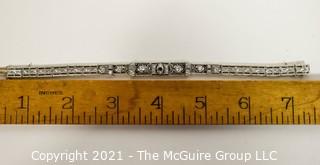 Antique Diamond Platinum over 14K Gold Art Deco Bracelet with Safety Catch.  Center Stone Missing.  Weighs approximately 15.8g