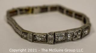 Antique Diamond Platinum over 14K Gold Art Deco Bracelet with Safety Catch.  Center Stone Missing.  Weighs approximately 15.8g