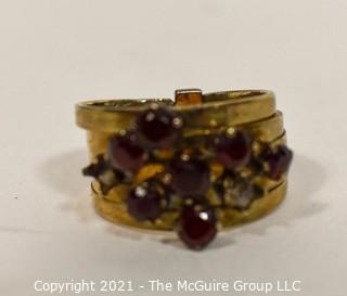 14kt Gold and Ruby Stacked Rings missing two stones.  Size approximately 6 1/2 and 4.5g Weight. 