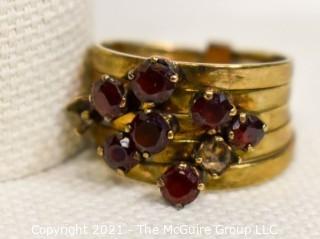 14kt Gold and Ruby Stacked Rings missing two stones.  Size approximately 6 1/2 and 4.5g Weight. 