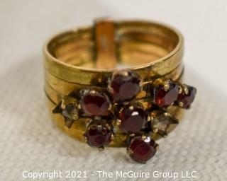 14kt Gold and Ruby Stacked Rings missing two stones.  Size approximately 6 1/2 and 4.5g Weight. 