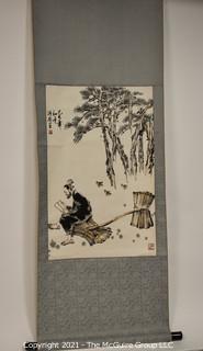 Asian Scroll Painting Depicting Man Reading with Straw Bundles. Signed with Chopmark.  Silk and Paper. Measures approximately 20 1/2" x 59".