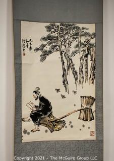 Asian Scroll Painting Depicting Man Reading with Straw Bundles. Signed with Chopmark.  Silk and Paper. Measures approximately 20 1/2" x 59".