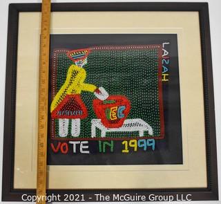 Framed Hand Beaded Fabric Tapestry Laizah IEC Vote 1999.  It measures approximately 23" squre.