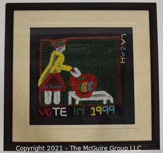 Framed Hand Beaded Fabric Tapestry Laizah IEC Vote 1999.  It measures approximately 23" squre.