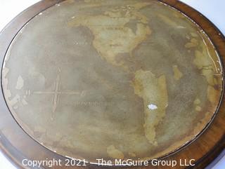 Round Metal Wall Plaque Mounted on Wood with Map of the World.  Measures approximately 21" diameter