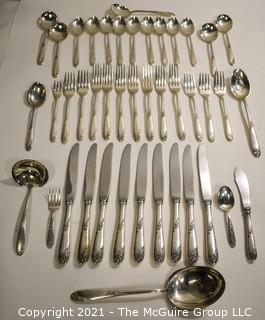 Set of Lunt Sterling Silver Flatware & Serving Utensils in "Sweetheart Rose" Pattern in Box.  Weighs approximately 1260 grams excluding knives. 