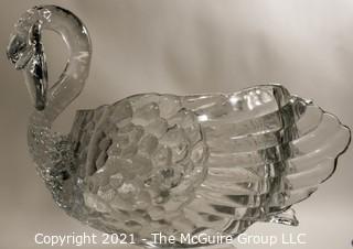 Unmarked Clear Cambridge Glass Swan Punch Bowl with 12 Swan Cups & Ladle. It measures approximately 15 long, 10" tall and 10" wide.  Chip in back tail feather. 