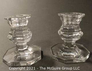 Baccarrat Clear Crystal Candlesticks or Holders.  Each measures approximately 3 1/2" tall and 3" wide at the base.