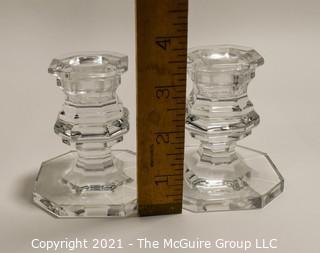 Baccarrat Clear Crystal Candlesticks or Holders.  Each measures approximately 3 1/2" tall and 3" wide at the base.