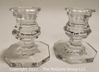 Baccarrat Clear Crystal Candlesticks or Holders.  Each measures approximately 3 1/2" tall and 3" wide at the base.