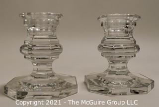 Baccarrat Clear Crystal Candlesticks or Holders.  Each measures approximately 3 1/2" tall and 3" wide at the base.