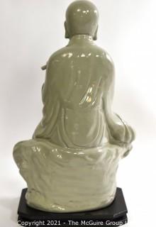 Large Ceramic with Green Glaze Asian Flute Player on Base made by Austin Prod. Inc.   It measures approximately 