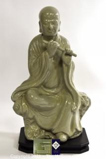 Large Ceramic with Green Glaze Asian Flute Player on Base made by Austin Prod. Inc.   It measures approximately 