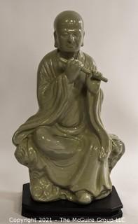 Large Ceramic with Green Glaze Asian Flute Player on Base made by Austin Prod. Inc.   It measures approximately 