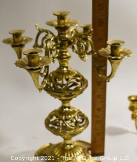 Two Ornation Brass Candlesticks with 4 and 5 Lights. 