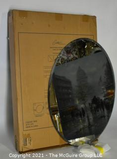 Gatco Beveled Framed Oval Tilting Wall Mount Mirror, New in Box.  Measures approximately 19-1/2" x 27-1/2" 