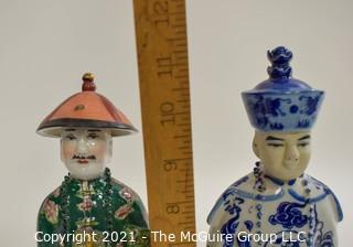 Two (2) Porcelain Hand Painted Asian Warrior Statues with Incised Chopmark Stamp on Base.   They measure approximately 11" tall. 