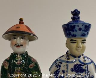 Two (2) Porcelain Hand Painted Asian Warrior Statues with Incised Chopmark Stamp on Base.   They measure approximately 11" tall. 