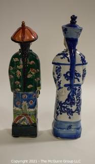 Two (2) Porcelain Hand Painted Asian Warrior Statues with Incised Chopmark Stamp on Base.   They measure approximately 11" tall. 