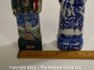 Two (2) Porcelain Hand Painted Asian Warrior Statues with Incised Chopmark Stamp on Base.   They measure approximately 11" tall. 