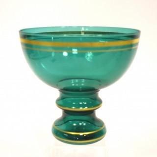 Green Glass with Gilt Trim Pedestal Bowl.  Measures approximately 8" tall.