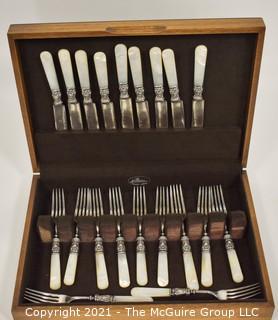 WM Rogers 12 dwt. marked Sterling and Mother of Pearl Handled Flatware Set in Box.  
