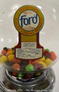 Ford Table Top Penny Gumball Machine with Original Glass Globe.  Working condition.  It measures approximately 12" tall.