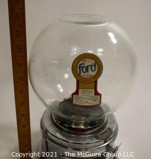 Ford Table Top Penny Gumball Machine with Original Glass Globe.  Working condition.  It measures approximately 12" tall.