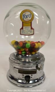 Ford Table Top Penny Gumball Machine with Original Glass Globe.  Working condition.  It measures approximately 12" tall.