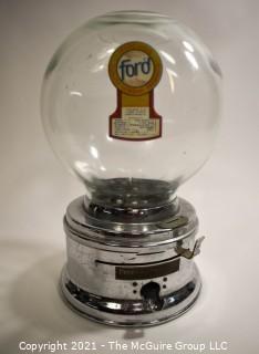 Ford Table Top Penny Gumball Machine with Original Glass Globe.  Working condition.  It measures approximately 12" tall.