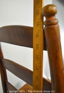 Primitive Hand Made Rocking Chair with Woven Cane Seat. 