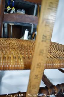 Primitive Hand Made Rocking Chair with Woven Cane Seat. 