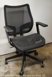 Adjustable Height Office Arm Chair with mesh seat and back; on castors; 36 1/2"T x 19" wide seat 