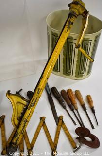 Eclectic Mix.  Includes Yellow Truck Jack, Metal Mid Century MCM Trash Can, EverReady Battery Display Board, Folding Carpenter Rulers, Hand Tools, Etc