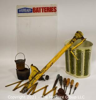 Eclectic Mix.  Includes Yellow Truck Jack, Metal Mid Century MCM Trash Can, EverReady Battery Display Board, Folding Carpenter Rulers, Hand Tools, Etc