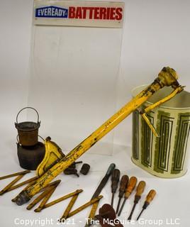 Eclectic Mix.  Includes Yellow Truck Jack, Metal Mid Century MCM Trash Can, EverReady Battery Display Board, Folding Carpenter Rulers, Hand Tools, Etc