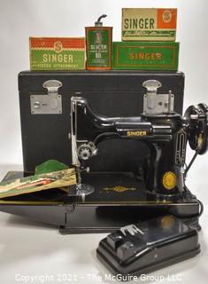 Singer Featherweight Sewing Machine with Accompanying Attachments in Box.